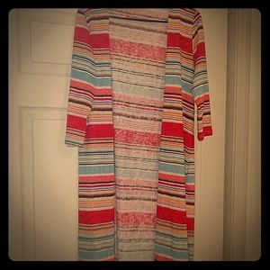 A red, yellow, blue, and white long cardigan